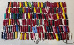 Lot of 189 Assorted Victorinox Classic SD Swiss Army Knives 58mm With & WithO Ads