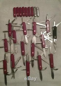 Lot of (24)Rare/Retire Wenger swiss Army Knife