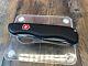 Pre-Owned VICTORINOX SWISS ARMY RESCUE TOOL POCKET KNIFE BLACK ONE HAND TREKKER