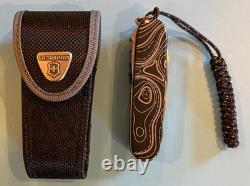 Victorinox, BRAND NEW, titanium +graded scales, lanyard access Victorinox sheath