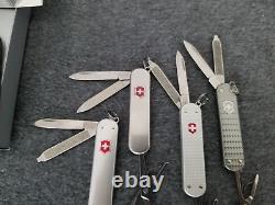 Victorinox Lot metal alox, ribbed smooth precious new in box and stainless used